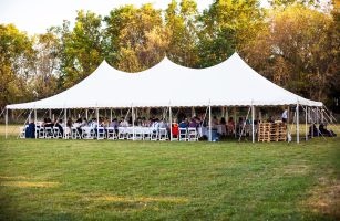 white-outdoor-tent-full-of-tables-and-people-seate-2021-08-30-04-13-58-utc-min